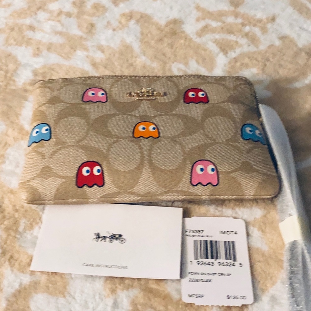 Limited edition coach pac-man wristlet.